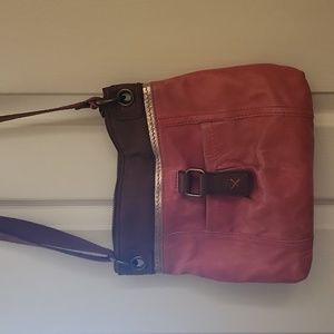 The Sak leather crossbows purse. Some staining on the back.